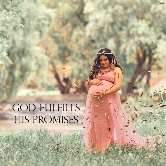 "God fulfills his promises." Pregnant woman standing in a field, smiling at her belly.